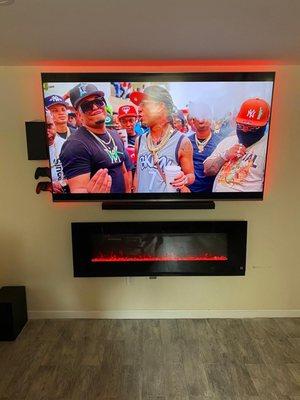 Samsung 82" tv, Samsung surround sound, Xbox X, Fire place