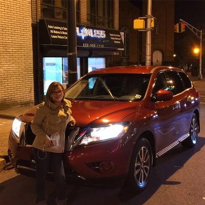 Shirley with her new 2015 Nissan Pathfinder from Flawless Auto Leasing & Sales.