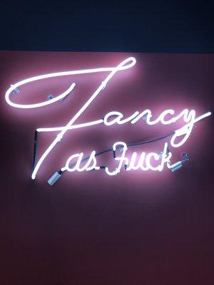 Super cute neon sign inside of ellae bisque boutique for cute photo op moments :)