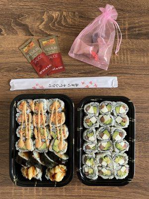 (left container, top to bottom): Spicy Crab Meat Roll, Spicy California Roll, Sweet Potato Tempura Roll; (right container) Philadelphia Roll