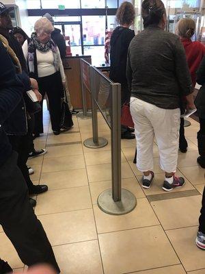 This bank is SO slow. Every time I come in here there is a line like this and 3-4 tellers. I hate this bank.