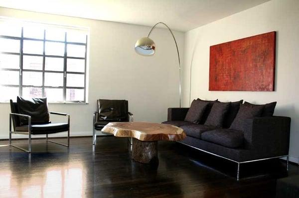 beautiful living room designed by nashville's best interior designer team using a  reclaimed wood table and modern furnishings.