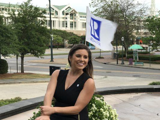 REALTOR Katie Beth Clark in downtown Mobile, AL across from the Mobile Convention Center, in front of the RSA Tower.