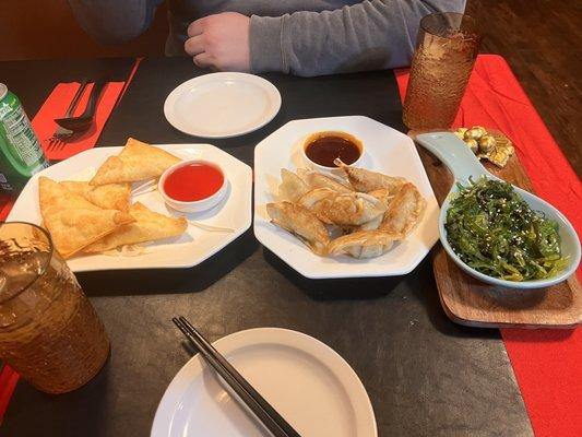 Cream cheese wontons, gyoza, wakame salad