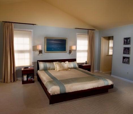 Custom bedding enhances the Mid-Century design in this master bedroom.