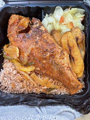 Red snapper with rice and beans, cabbage and plantains .