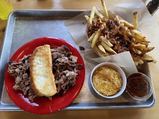 Pulled pork and brisket, corn pudding and cheese fry's.