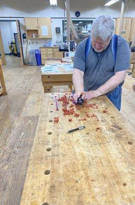 Jeff Marsden giving demonstration of how to use chopsticks maker tool