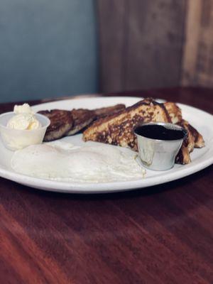 Jumbo French toast with eggs and bacon