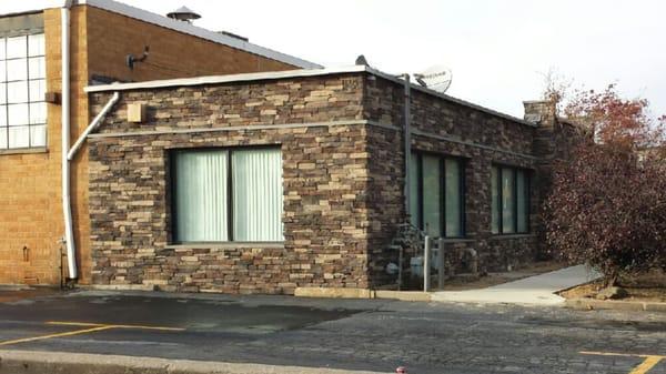 Culture Stone put on old brick building