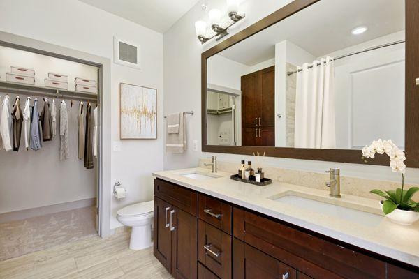 Rich, dark cabinetry and large closet spaces.