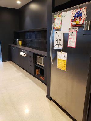 Clean kitchen,  large fridge and a couple of microwaves.  Also a sink for dishwasher (not pictured)