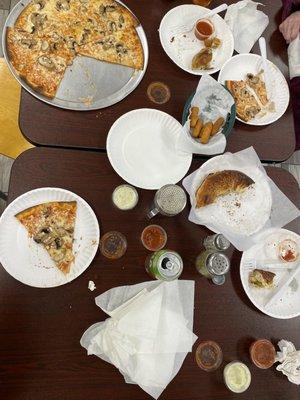 Mushroom pizza thin crust, spinach baked good, mozzarella cheese sticks and marinara sauce.