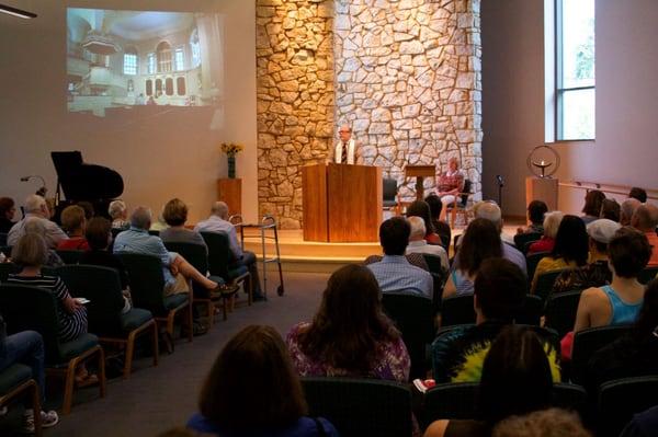 Rev. Tom leading Sunday service in DUUC's Sanctuary.