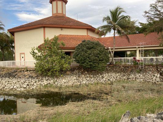 Cleaning out gutters and cleaning tile roof