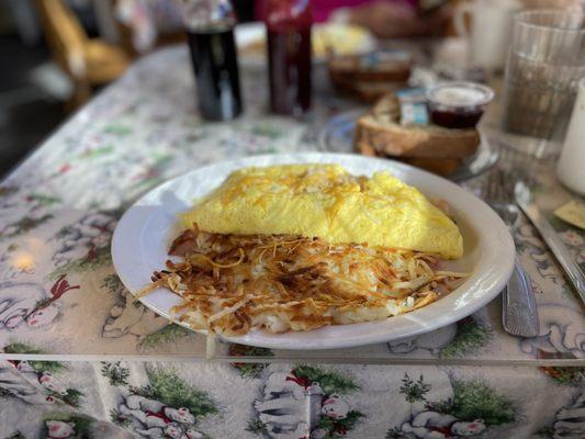 H.M.C. Omelette. (Ham mushroom and cheese) and hashbrowns.