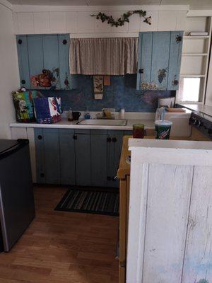 This is the kitchen , mich older looking than apartment, but functional with coffee pot and toaster, a little rusty but works