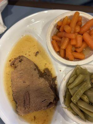 Pot roast with au jus, Italian green beans, and baby carrots.