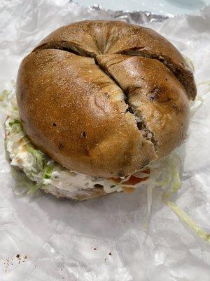 Cinnamon raisin with lox, cream cheese, lettuce,tomato, onion and capers . Toasted and scooped out.