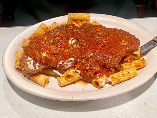 Veal parmigiana over rigatoni.