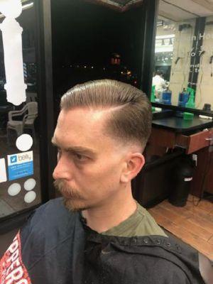 Bold fade with pushed back haircut