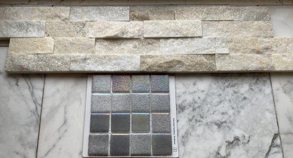 Selection of high beam natural white artic rock and the opal gray metallic mosaic tiles.