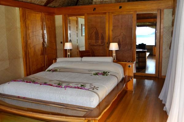 Beautiful wood work in the bungalow - comfortable air conditioned room covered in flowers upon arrival