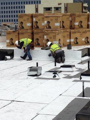 built-up BUR cool roof over concrete deck and tapered insulation system on new apartment building in downtown LA.