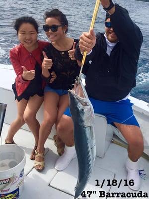 These girls had a blast reeling in this monster barracuda