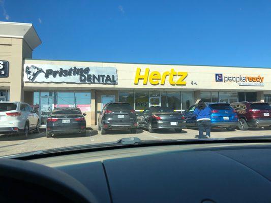 Hertz, right next to Pristine Dental and peopleready.