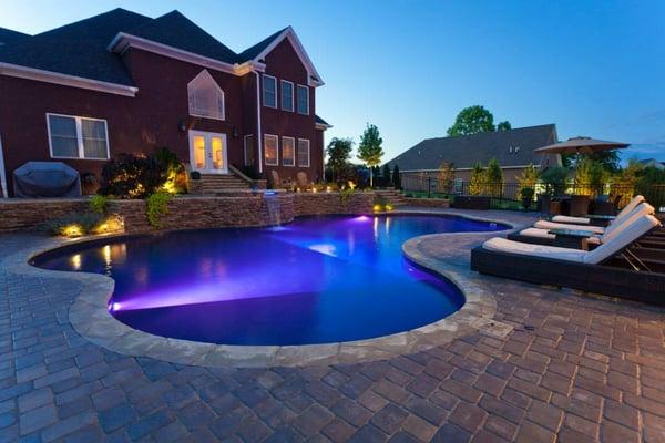 Poolside patio with custom outdoor lighting