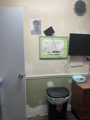 The room visibly dirty and was in terrible condition, no idea who the picture is of on the wall.