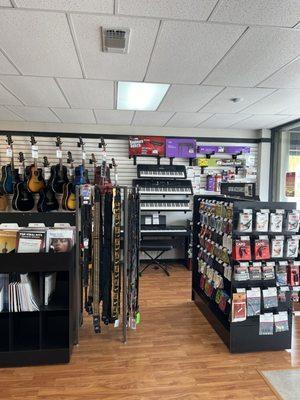 Keyboards, guitar accessories and music books