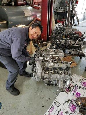 Julio replacing a BMW engine with twin turbochargers.