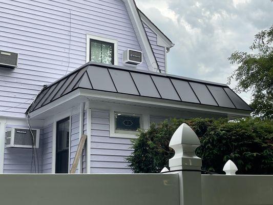 Beautifully crafted and custom fabricated black metal roof trim.