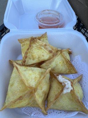 Crab Rangoon look and taste homemade, with a delicate thin dough and an inside with visible pink stuff that probably is crab.