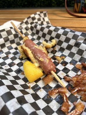 Corn dog that taste like a sick pig  and whatever that uncooked dough is on the inside