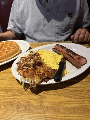 Waffle breakfast with polish sausage.