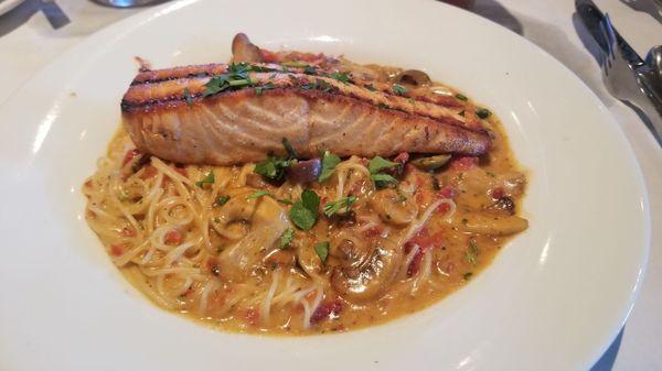 I made my own pasta dish. Grilled salmon on capellini, mushrooms, sundried tomatoes, & olives with creamy roasted garlic sauce.