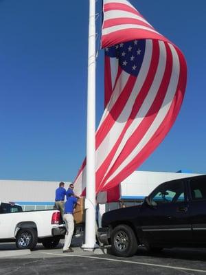 It took a small army to raise our new flag but our sales professionals were up for the challenge :)