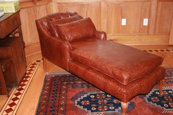 Upholstered in embossed leather.