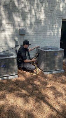 Our tech checking the heat pump for the upstairs system.