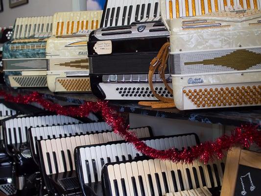 Vintage accordions.   Dig the gold sparkles and the turquoise!