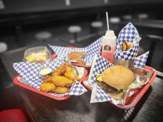 Cheeseburger with Fries, buffalo wings, pork chop, butter pecan cake, and a daiquiri of course (it can be too go too!)