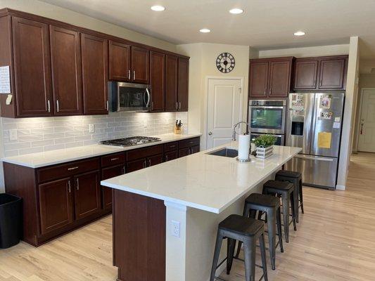 Replaced original dark-ish granite countertops with new quartz countertops from 8A.