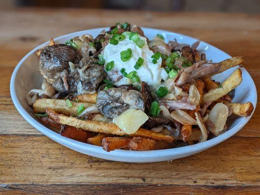 09/30/23 Duck Confit Poutine - Hand cut Fries, Cheese Curds, Creme Fraiche, Wild Mushroom Gravy, Chives