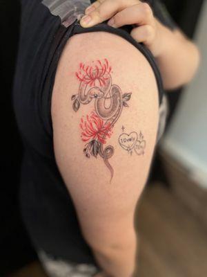 Snake with spider lilies tattoo