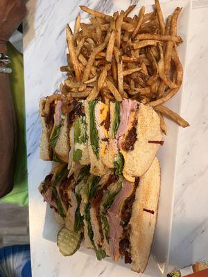 Triple Decker Club with a mound of fries