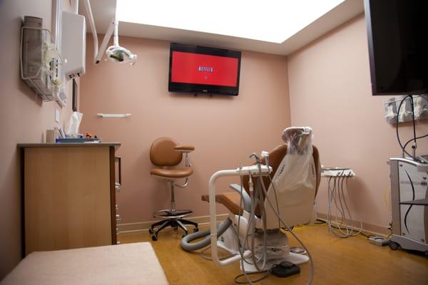 Our cozy, spacious updated treatment rooms include TV to take your mind off 'the work'.