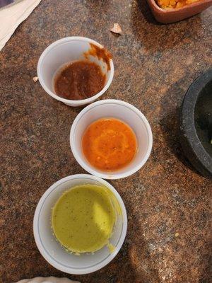 The stop light trio! Hand made sauses to sample. Green  yellow  red   Go, slow, stop if you don't like HOT! Handmade to sample.